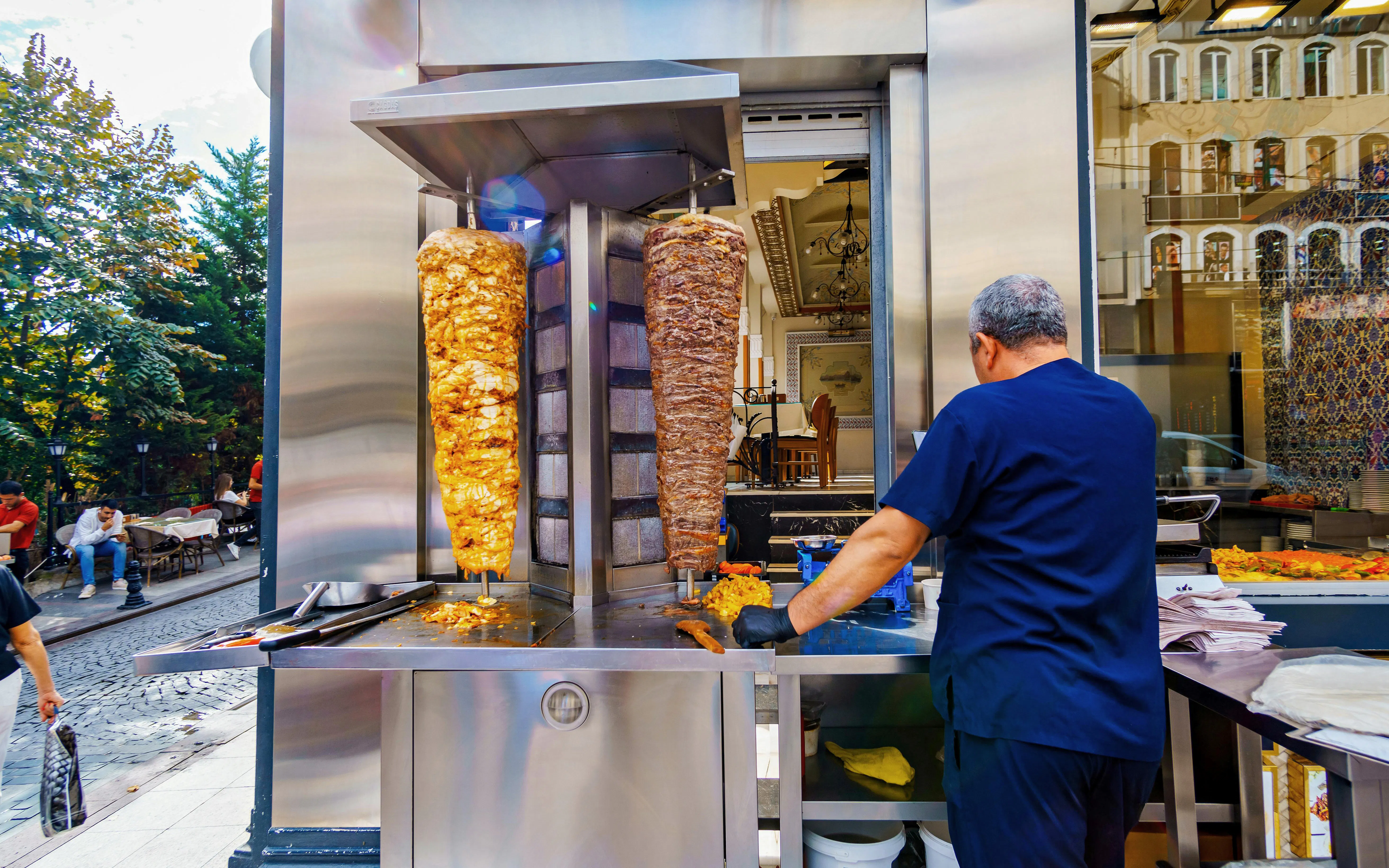 Grilling shawarma meat on a street in Istanbul, Turkey during a food tour.
