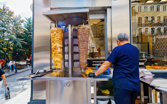 Grilling shawarma meat on a street in Istanbul, Turkey during a food tour.