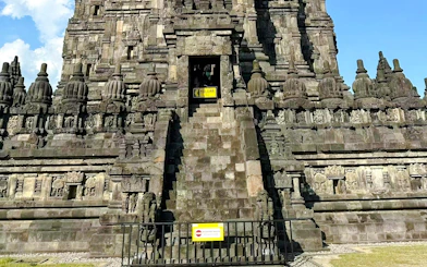 Prambanan Temple stone carvings and entrance steps in Yogyakarta, Indonesia.