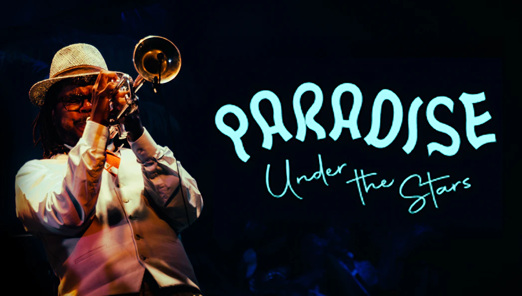 Musician playing trumpet at Paradise Under the Stars event.