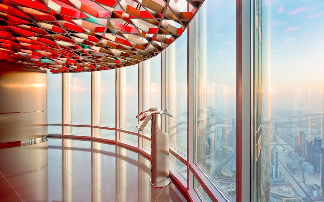 Observation deck view from Burj Khalifa Level 124, overlooking Dubai cityscape.