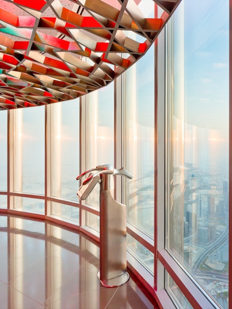 Observation deck view from Burj Khalifa Level 124, overlooking Dubai cityscape.