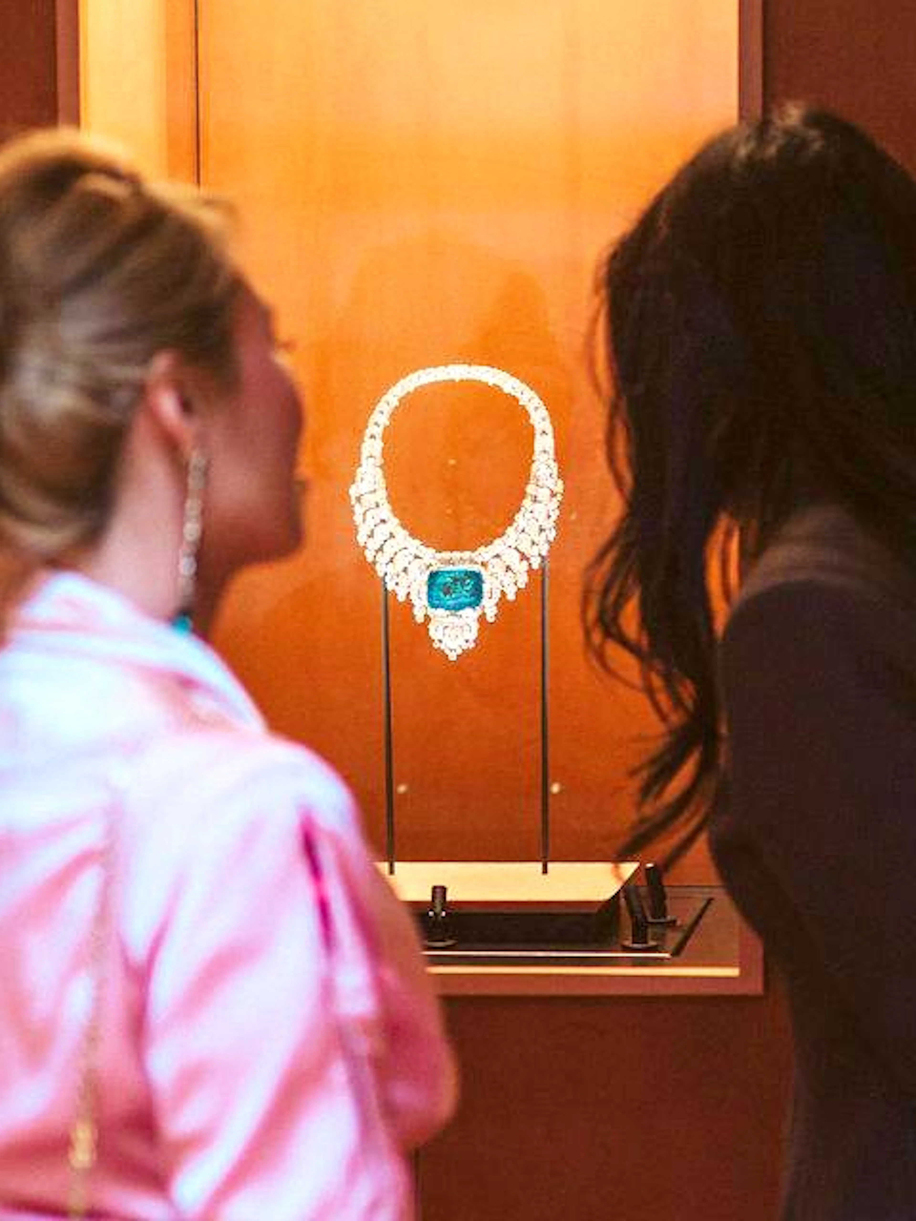 Visitors admiring Cartier necklace at NGV Friday Nights, National Gallery Victoria.
