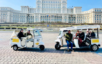 Tuk tuks in front of the Palace of the Parliament during Bucharest Highlights Tour.