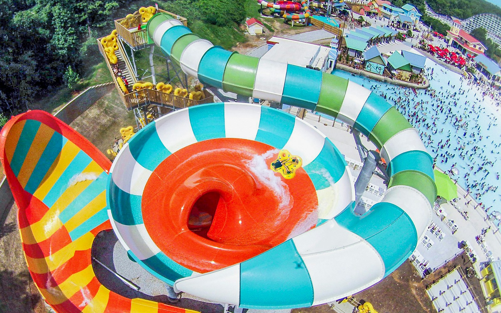 Water slide at Six Flags Over Georgia with people enjoying the ride.