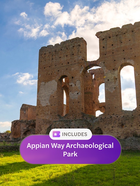 Ancient ruins at Appian Way Archaeological Park under a bright blue sky.