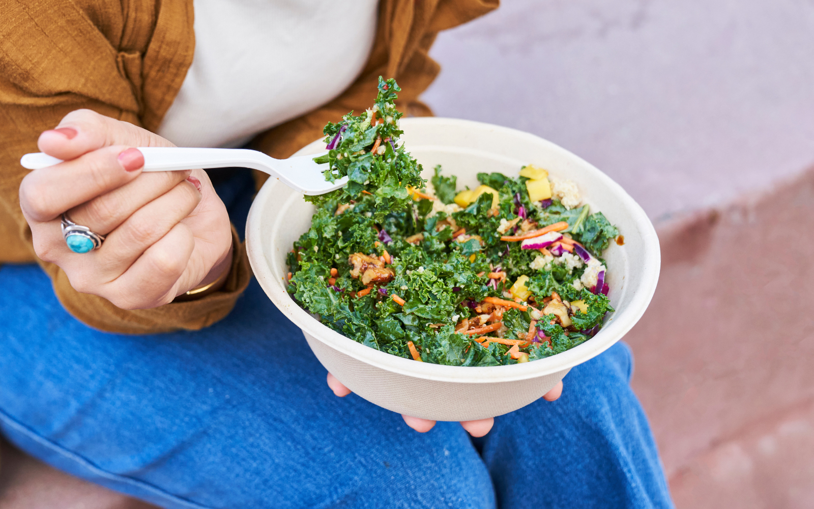 women eating salad in zoo kiosk