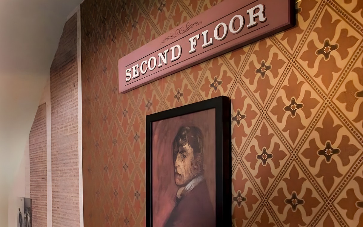 Second floor sign and portrait at Jack the Ripper Museum, London.