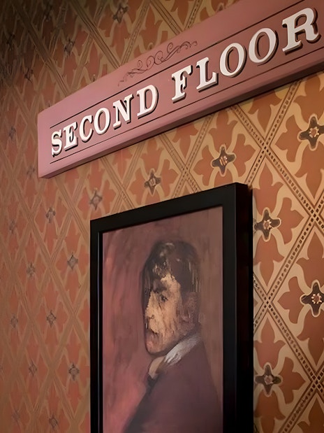 Second floor sign and portrait at Jack the Ripper Museum, London.