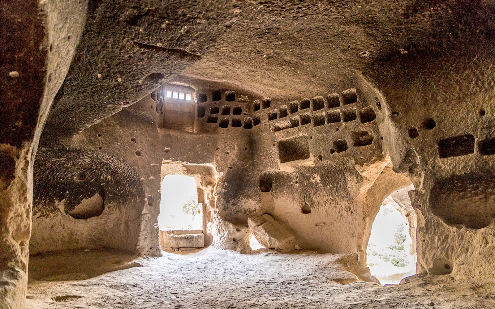 Church interior with altar and painted decorations at Zelve Open Air Museum, Cappadocia.