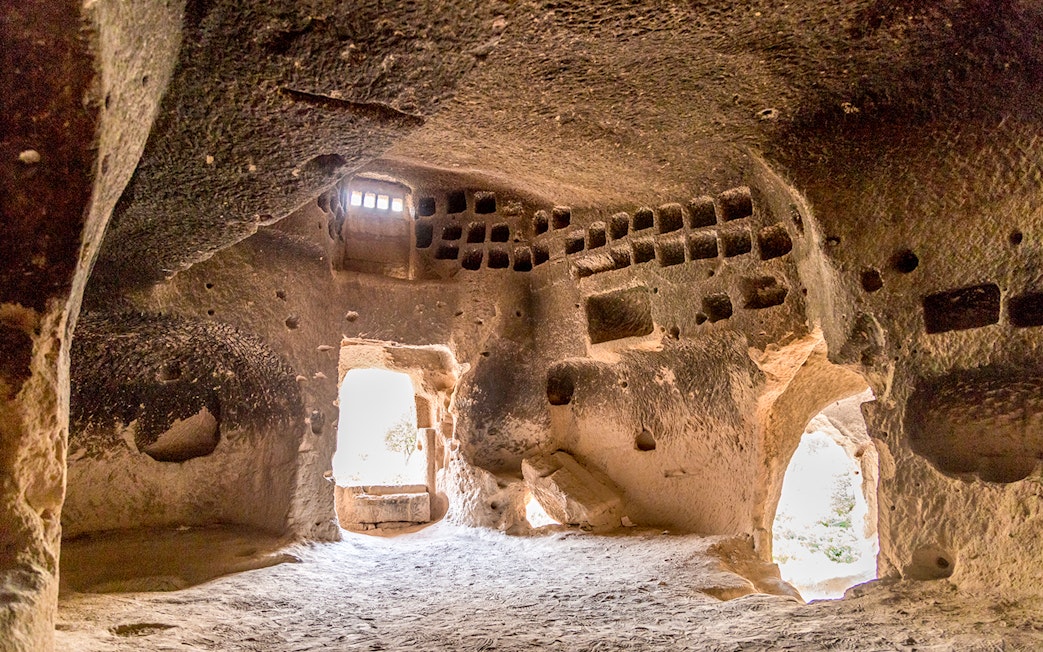 Church interior with altar and painted decorations at Zelve Open Air Museum, Cappadocia.