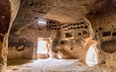 Church interior with altar and painted decorations at Zelve Open Air Museum, Cappadocia.
