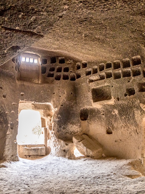 Church interior with altar and painted decorations at Zelve Open Air Museum, Cappadocia.