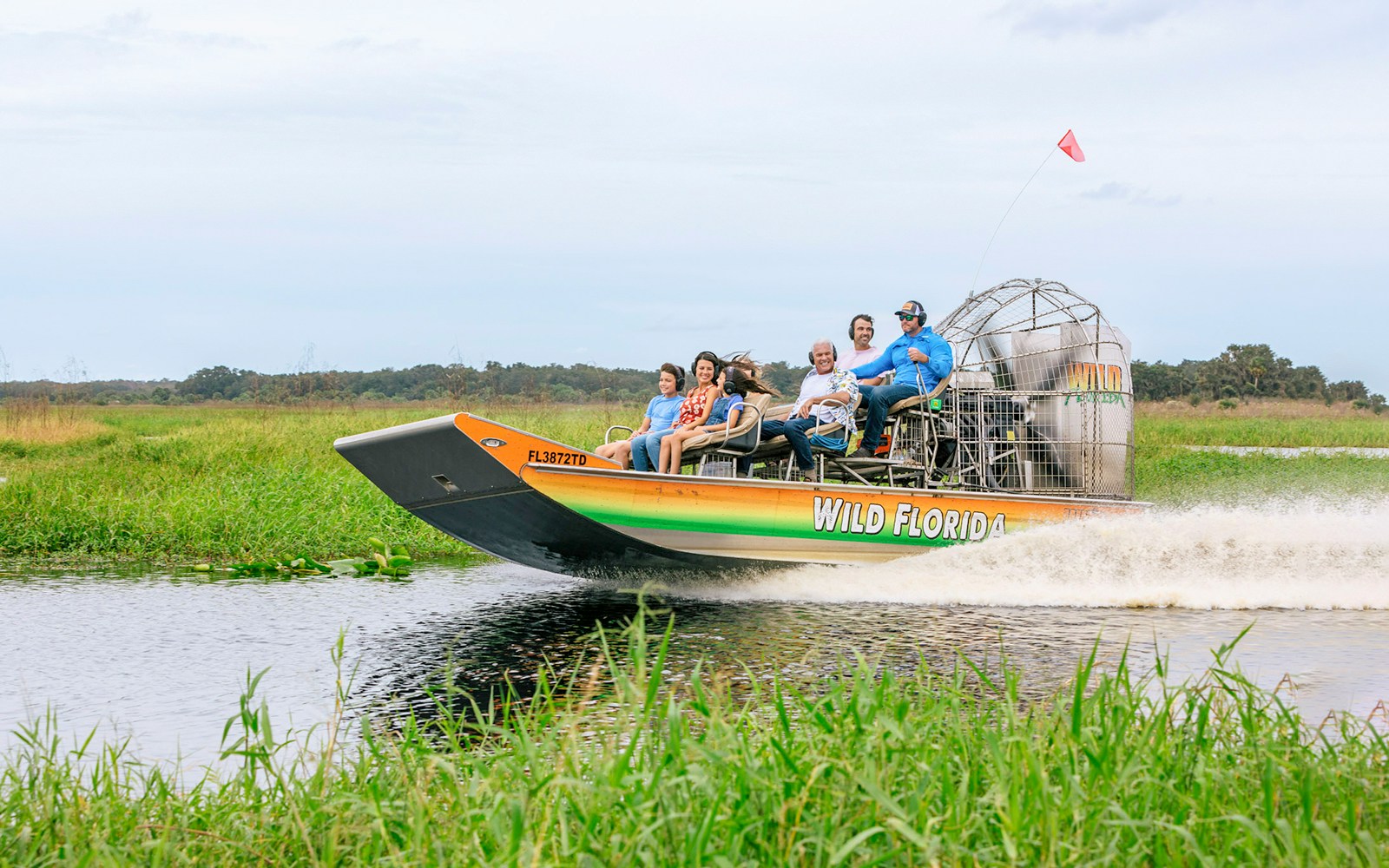 Guests on an airboat tour in the Everglades, Florida.
