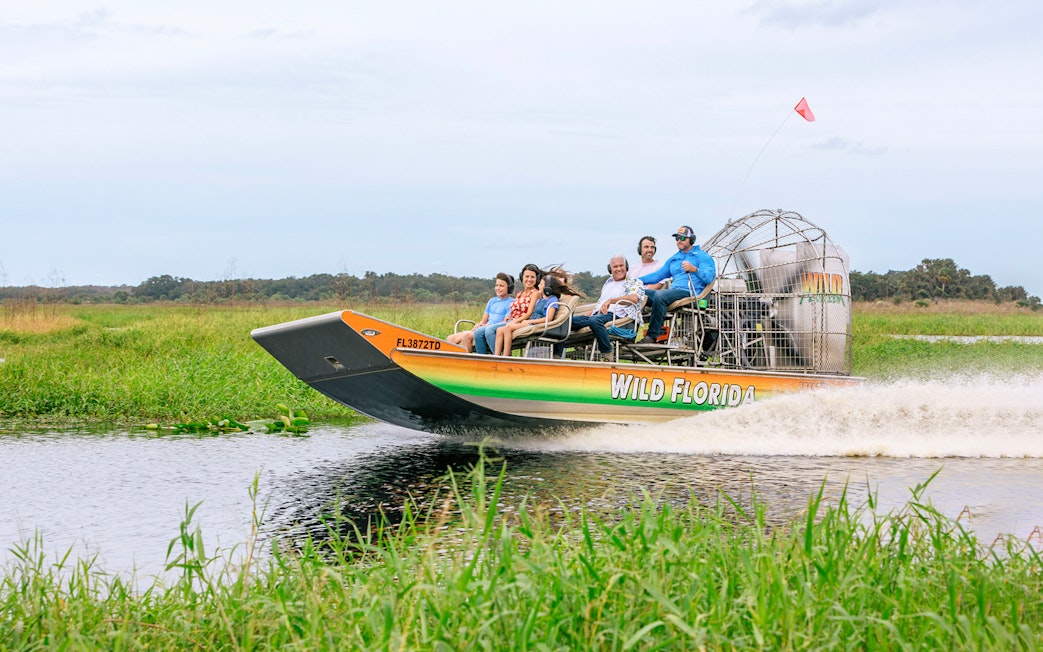 Guests on an airboat tour in the Everglades, Florida.