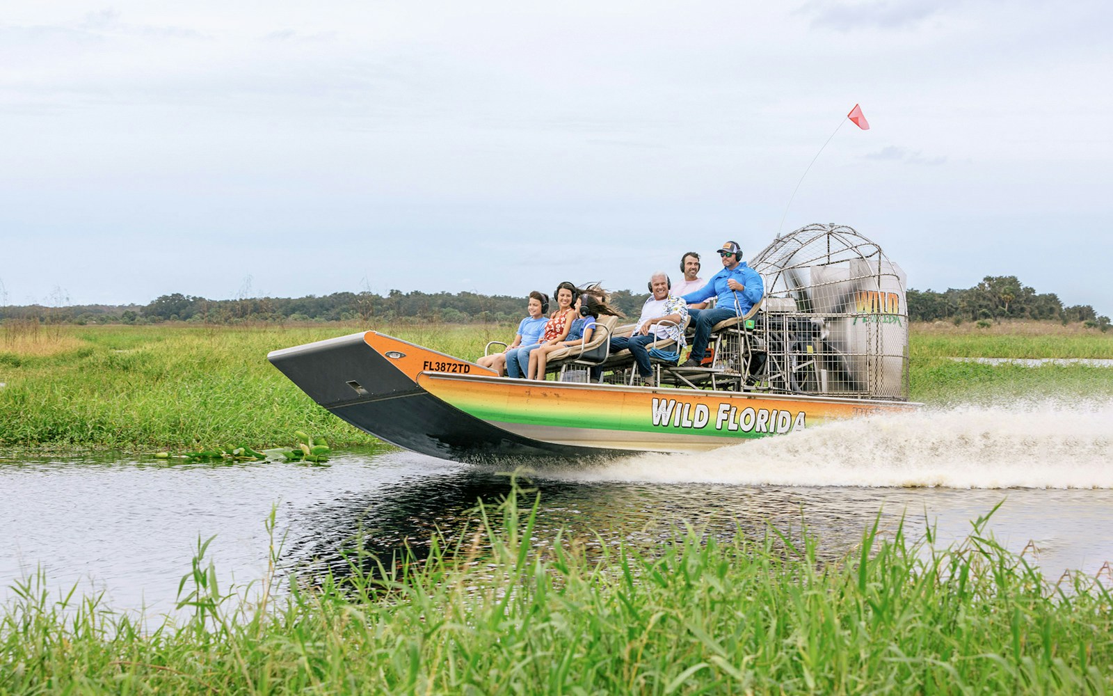Guests on an airboat tour in the Everglades, Florida.