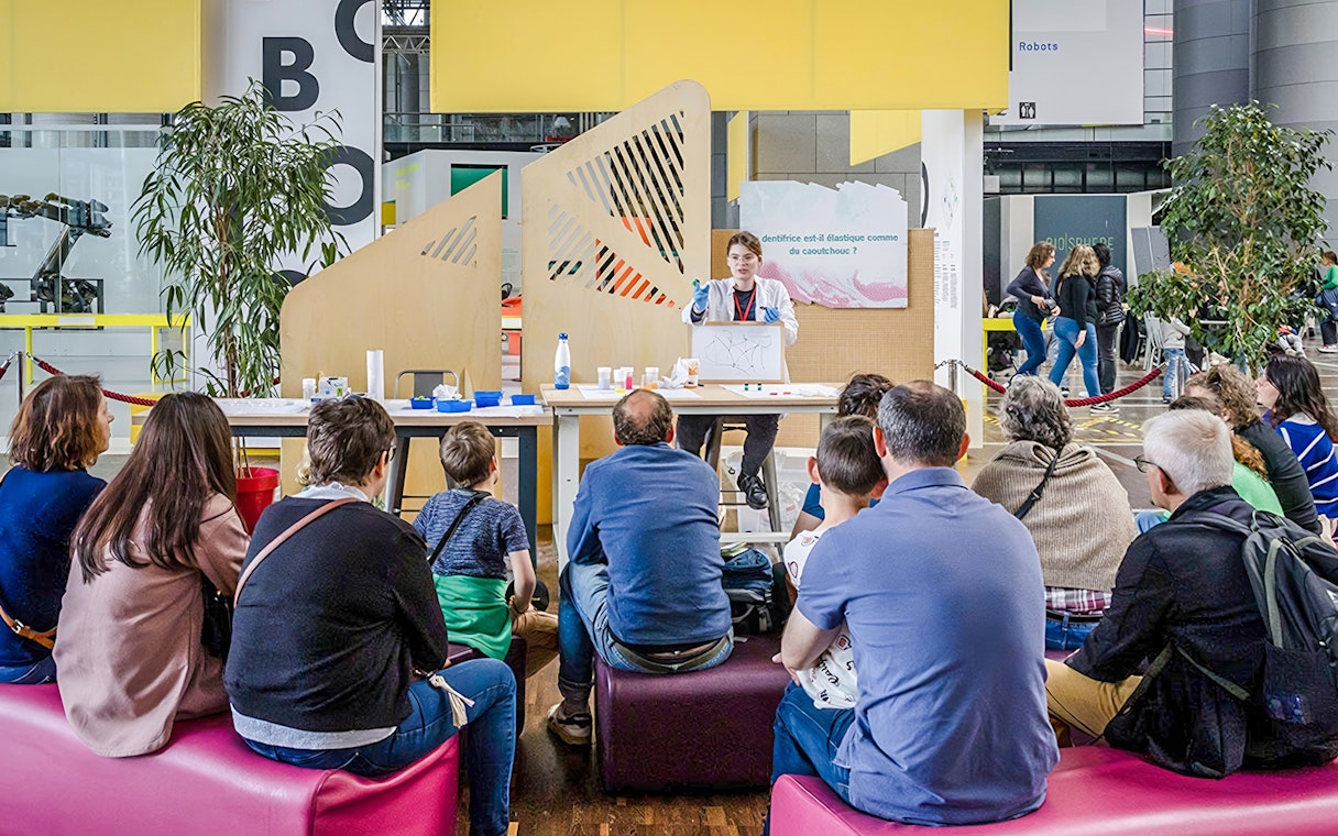 Audience attending a science demonstration at Cité des Sciences et de l'Industrie, Paris.