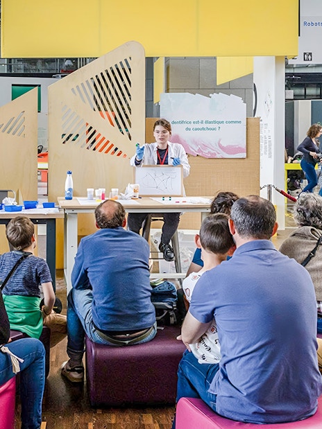 Audience attending a science demonstration at Cité des Sciences et de l'Industrie, Paris.