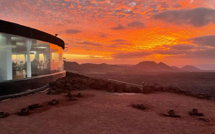 Restaurant with diners at sunset in Timanfaya National Park, Lanzarote.