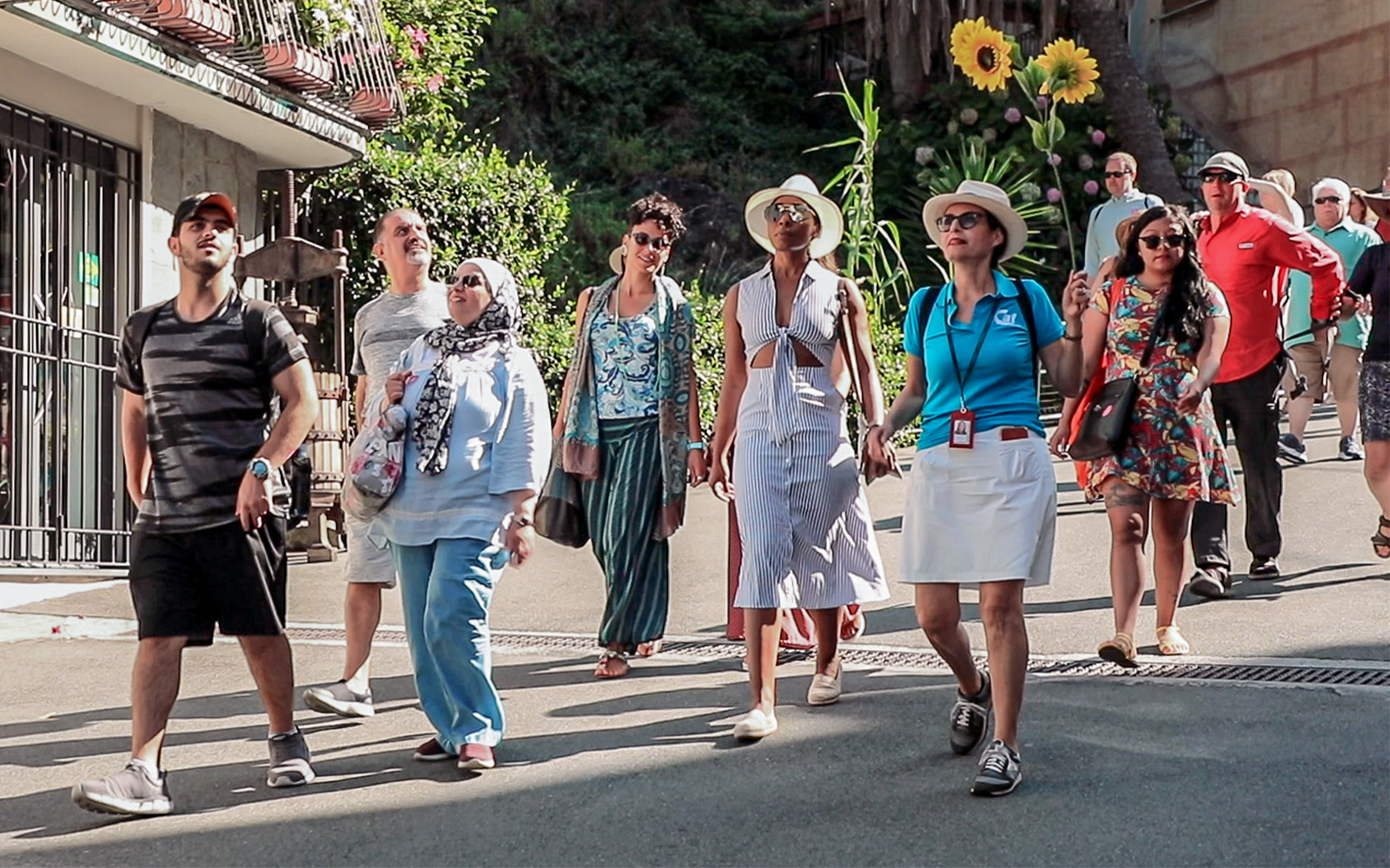 Group of tourists walking in La Spezia, Italy, during a guided tour.