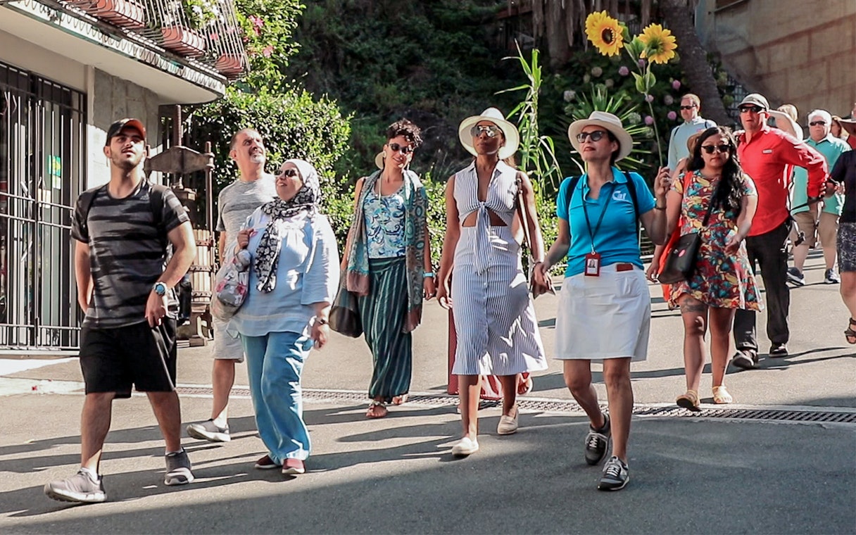 Group of tourists walking in La Spezia, Italy, during a guided tour.