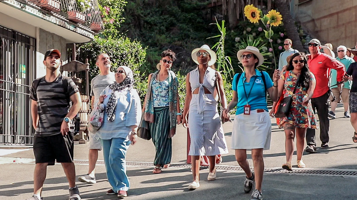 Group of tourists walking in La Spezia, Italy, during a guided tour.