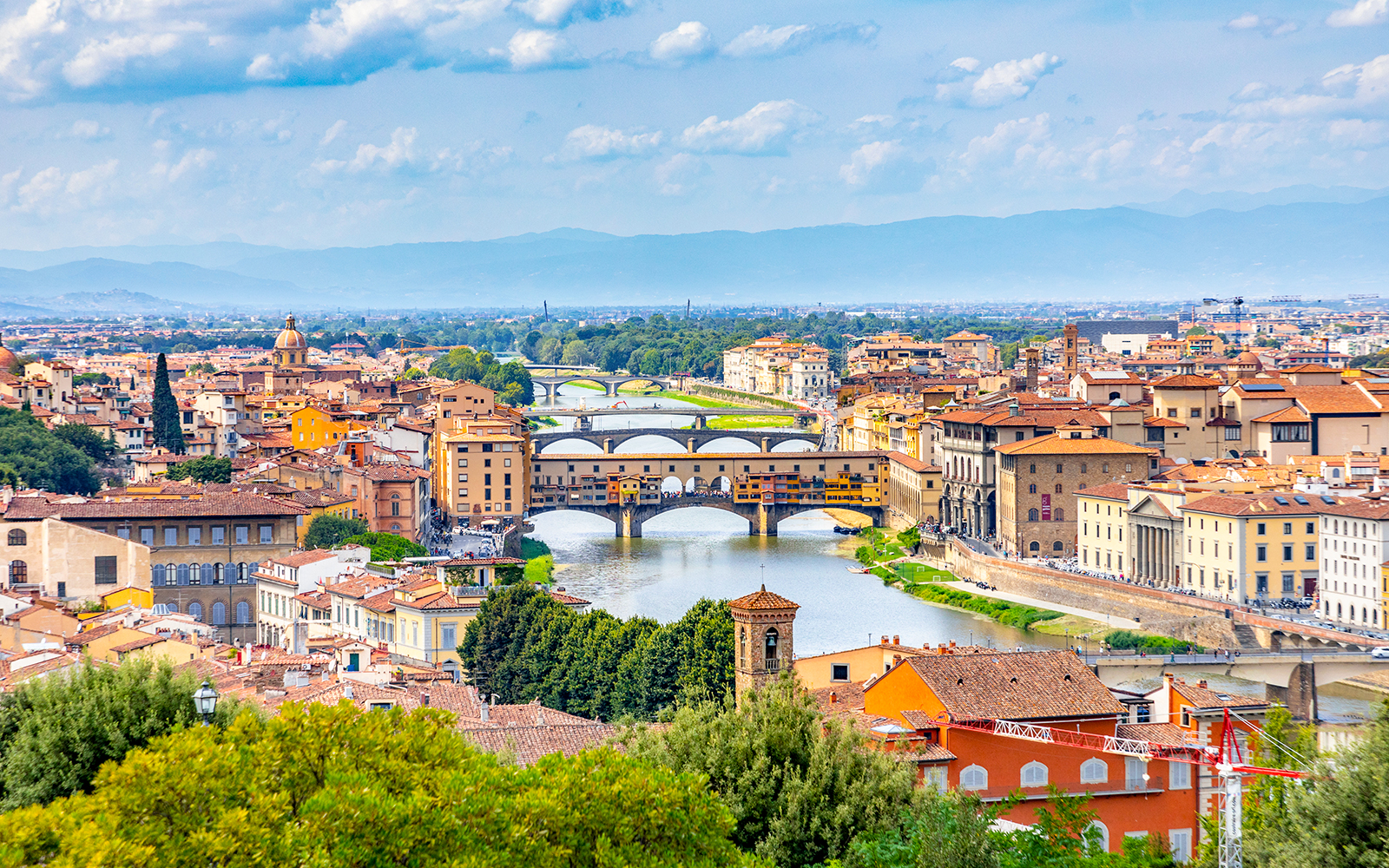 Florence cityscape with Ponte Vecchio and Arno River, Italy day trip.