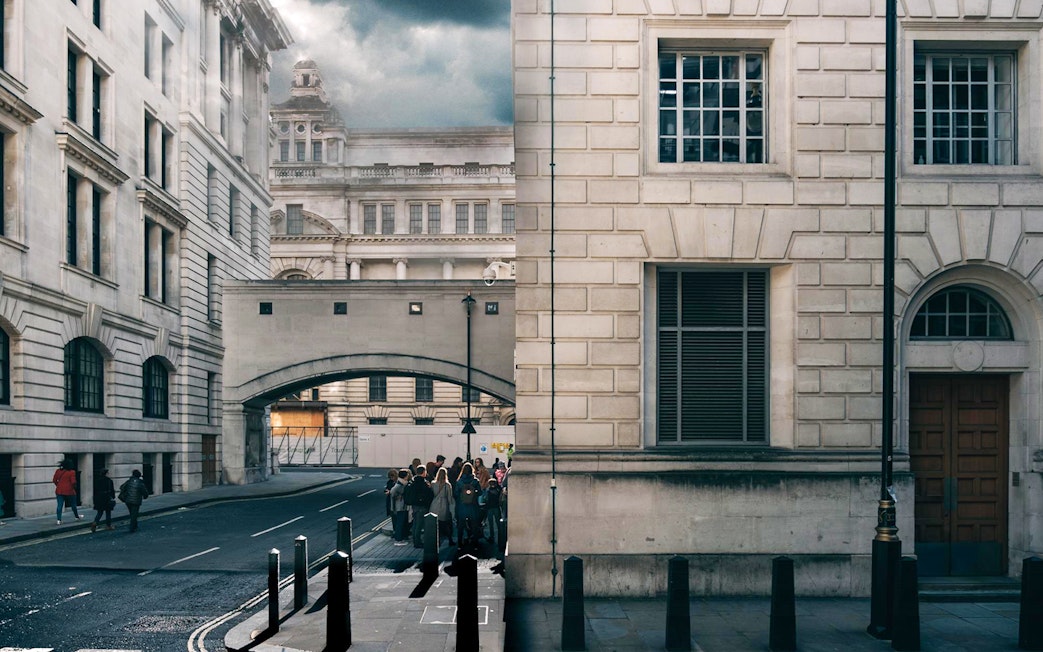 Tour group exploring Harry Potter film locations near Millennium Bridge, London.