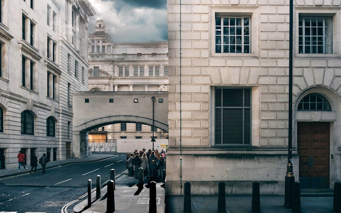 Tour group exploring Harry Potter film locations near Millennium Bridge, London.