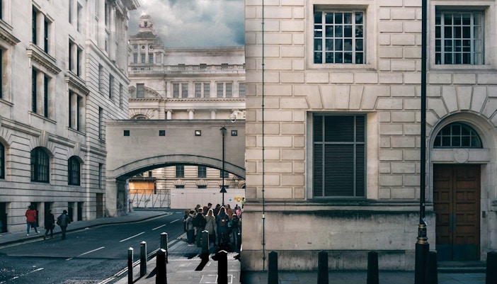 Tour group exploring Harry Potter film locations near Millennium Bridge, London.