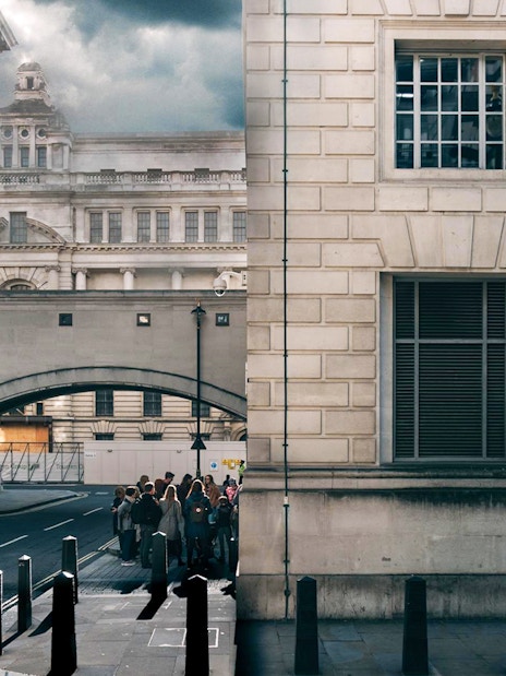 Tour group exploring Harry Potter film locations near Millennium Bridge, London.