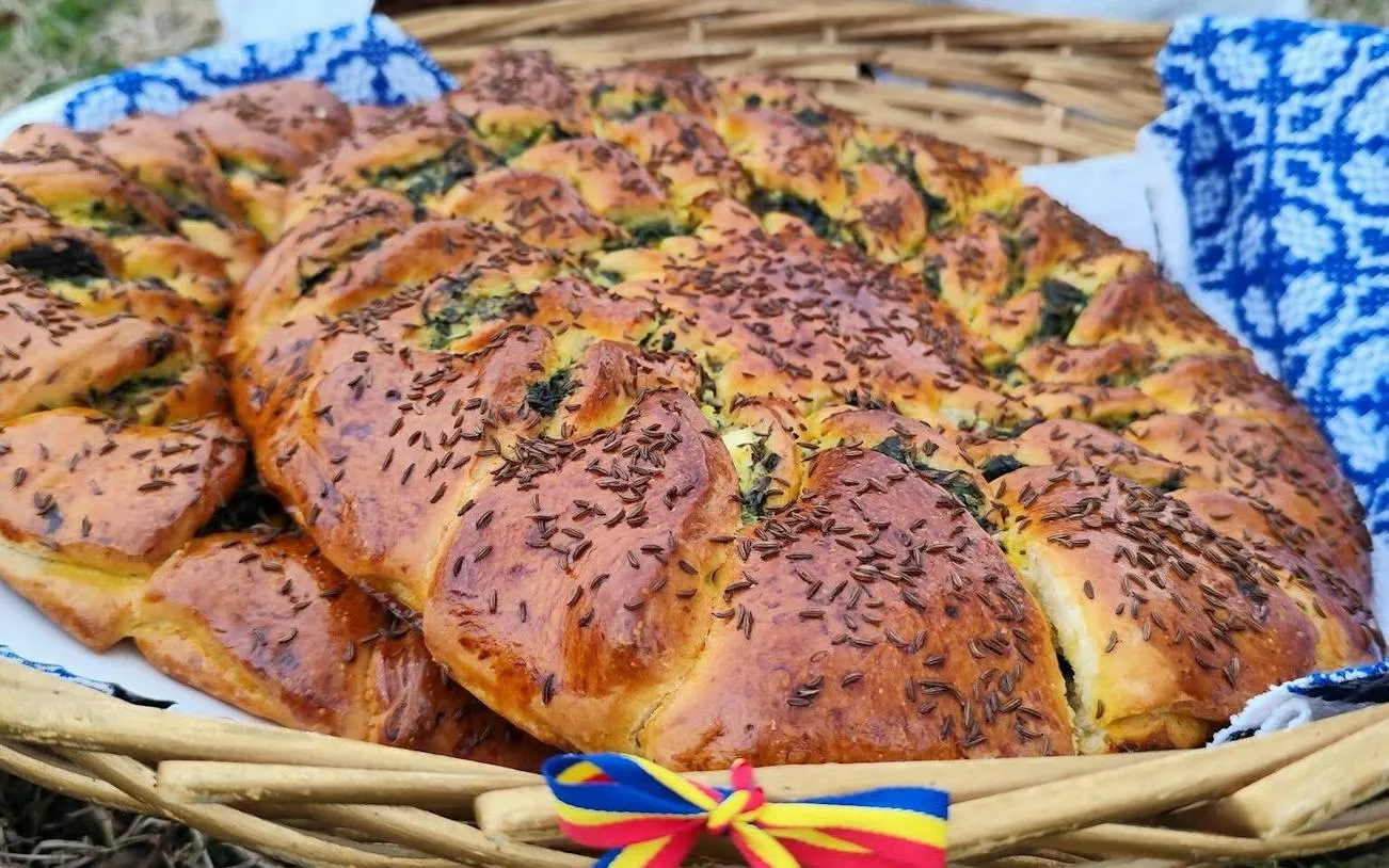 Traditional Romanian bread with seeds in a woven basket, Constanța.