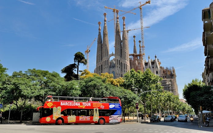 Barcelona tour bus in front of Sagrada Familia.