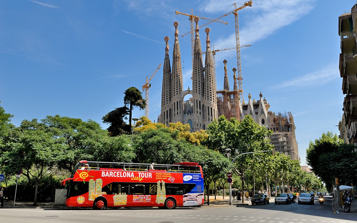 Barcelona tour bus in front of Sagrada Familia.