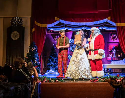 People dressed up as Santa Claus, and a wizard gnome