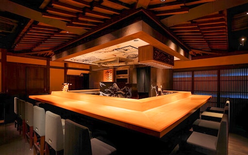 Yakitori Tsukiya dining area with wooden counter for 6/9-course yakitori meal.