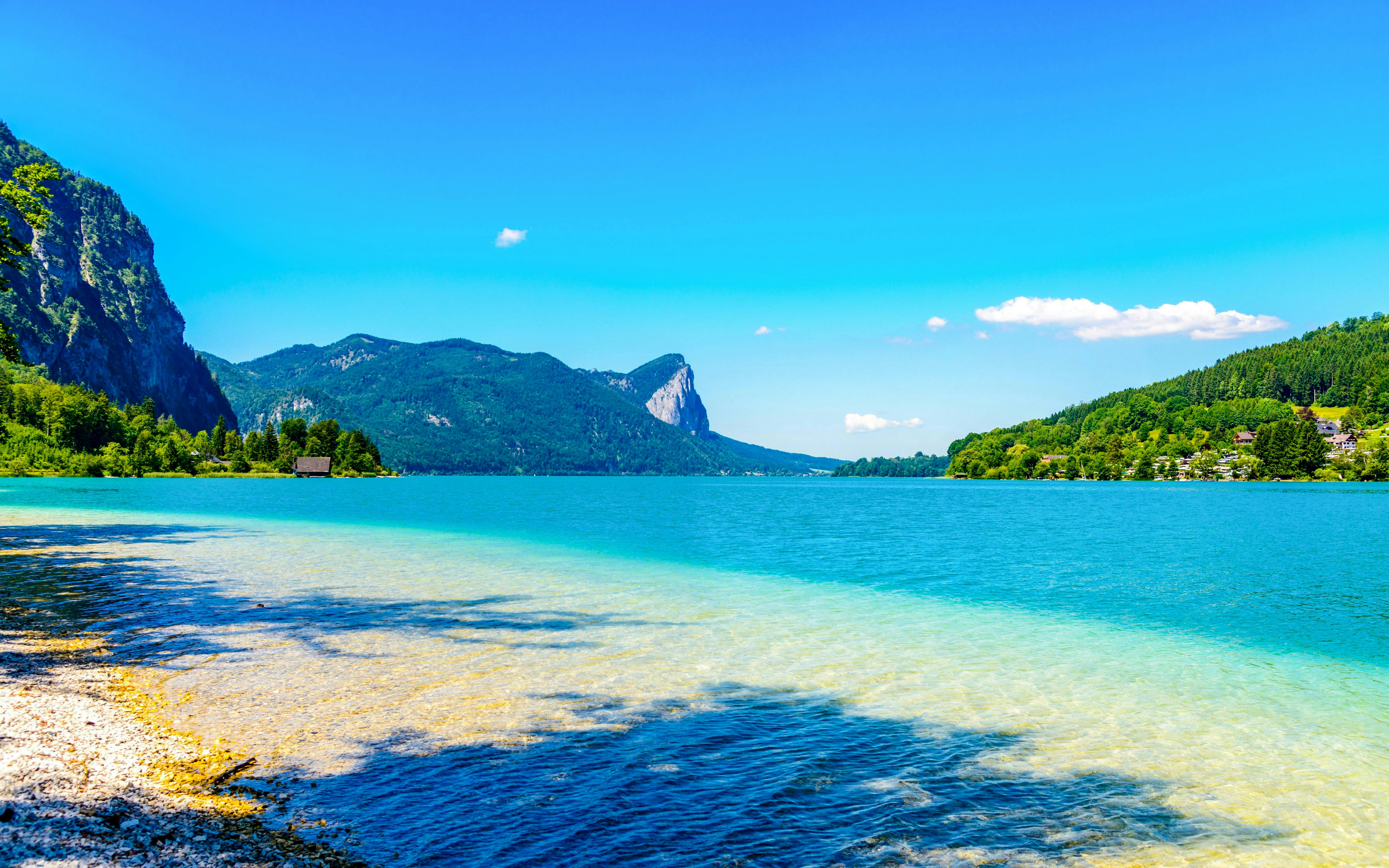 Clear lake with mountain backdrop in Salzkammergut, near Hallstatt, Austria.