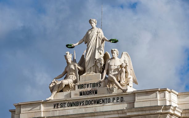 Statues atop Arco da Rua Augusta in Lisbon, Portugal, near Lisboa Story Centre.