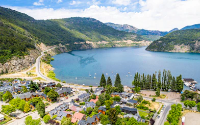 Panoramic view of San Martín de los Andes and Lake Lácar with Andes Mountains.