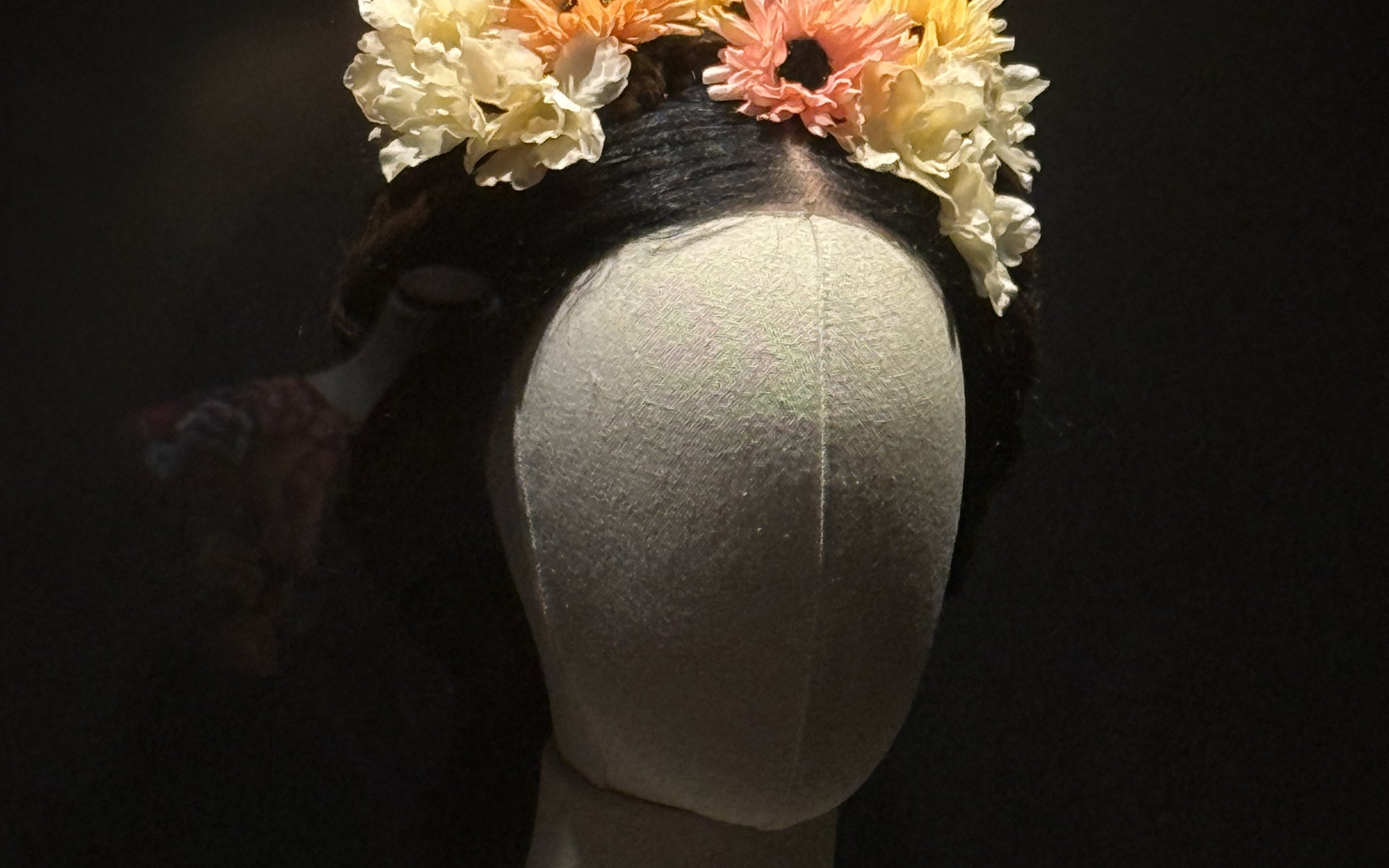 Mannequin with floral headpiece at Frida Kahlo Museum, La Casa Roja.