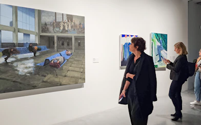 Visitors viewing paintings at Picasso's Birthplace Museum.