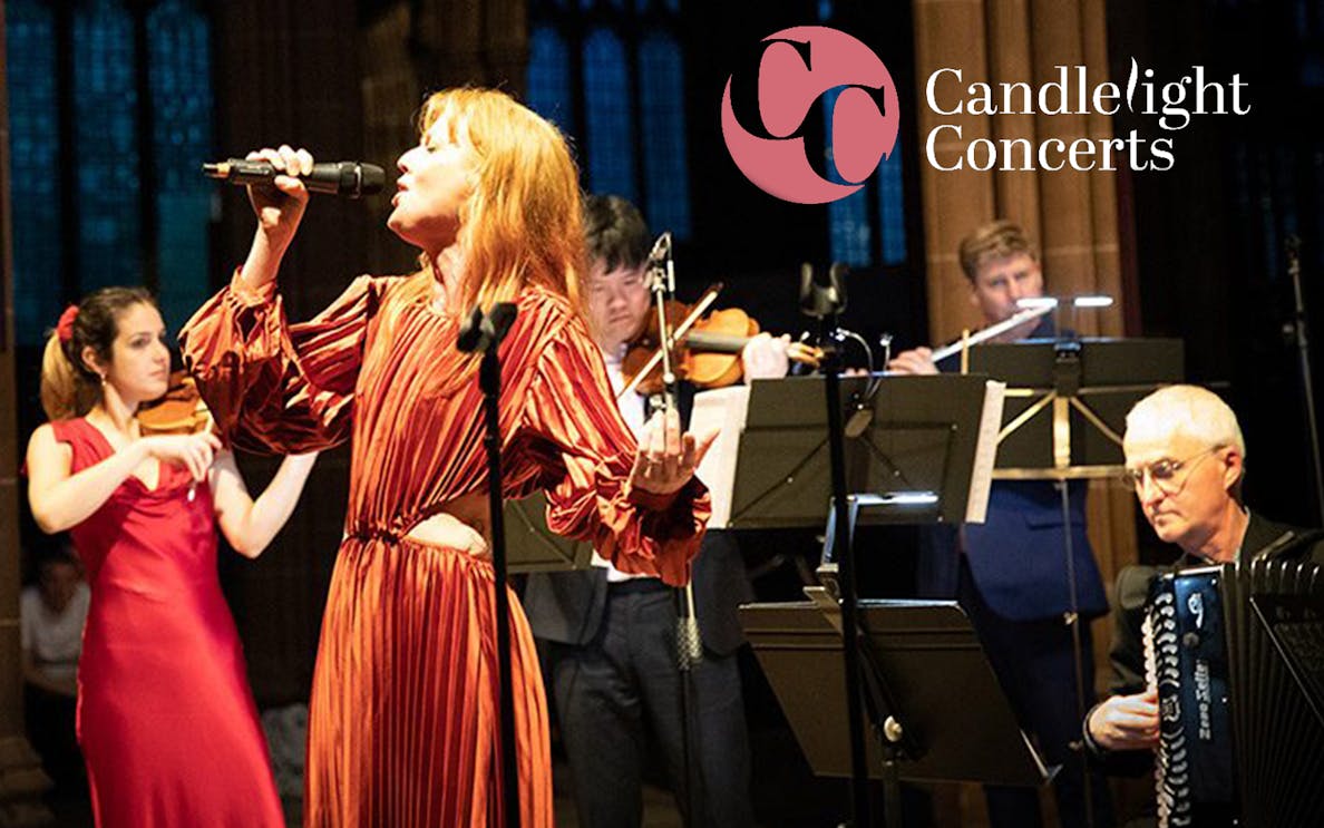 Singer and musicians performing West End musicals by candlelight.