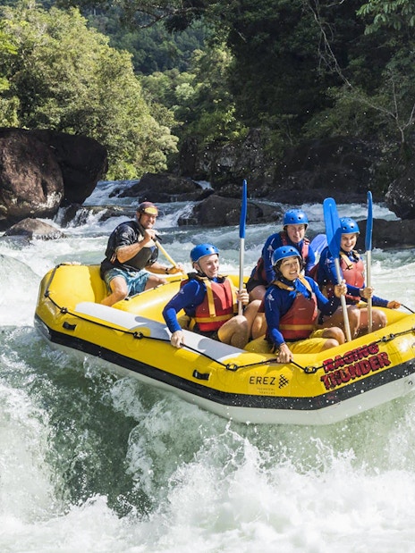 Rafting group navigating rapids on Barron River during Guided Raging Thunder Rafting Experience.