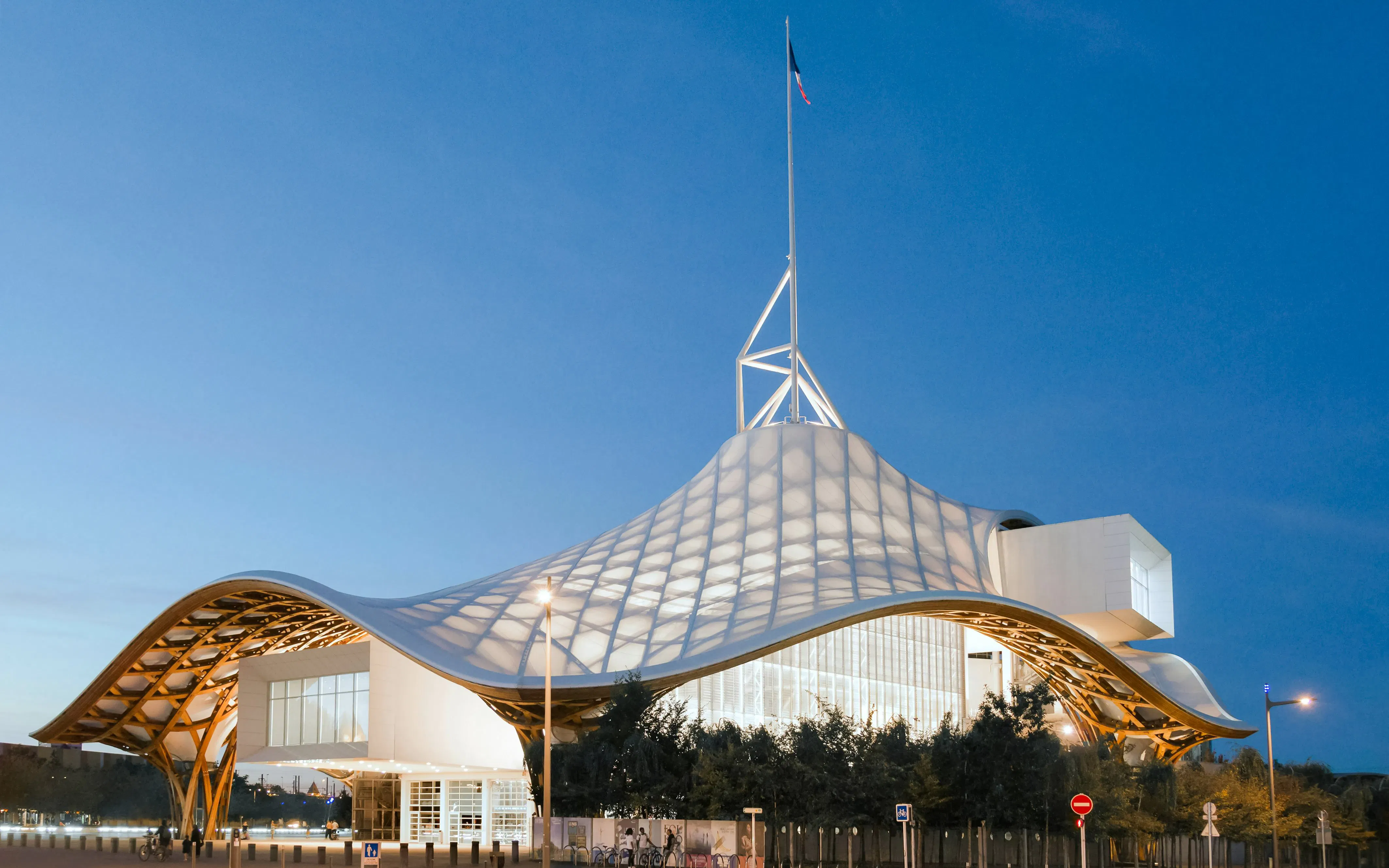 Centre Pompidou-Metz with its distinctive wavy roof at dusk in Metz, France.