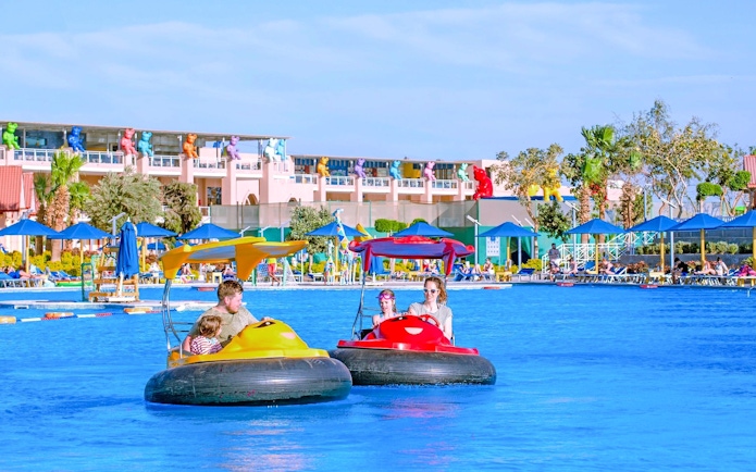 Family enjoying bump boat ride at Neverland Waterpark, Pickalbatros, Hurghada.