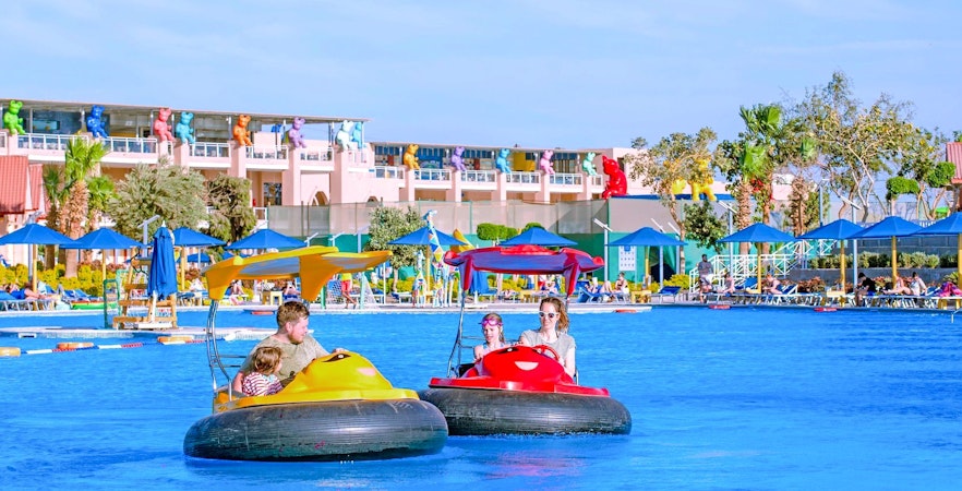Family enjoying bump boat ride at Neverland Waterpark, Pickalbatros, Hurghada.