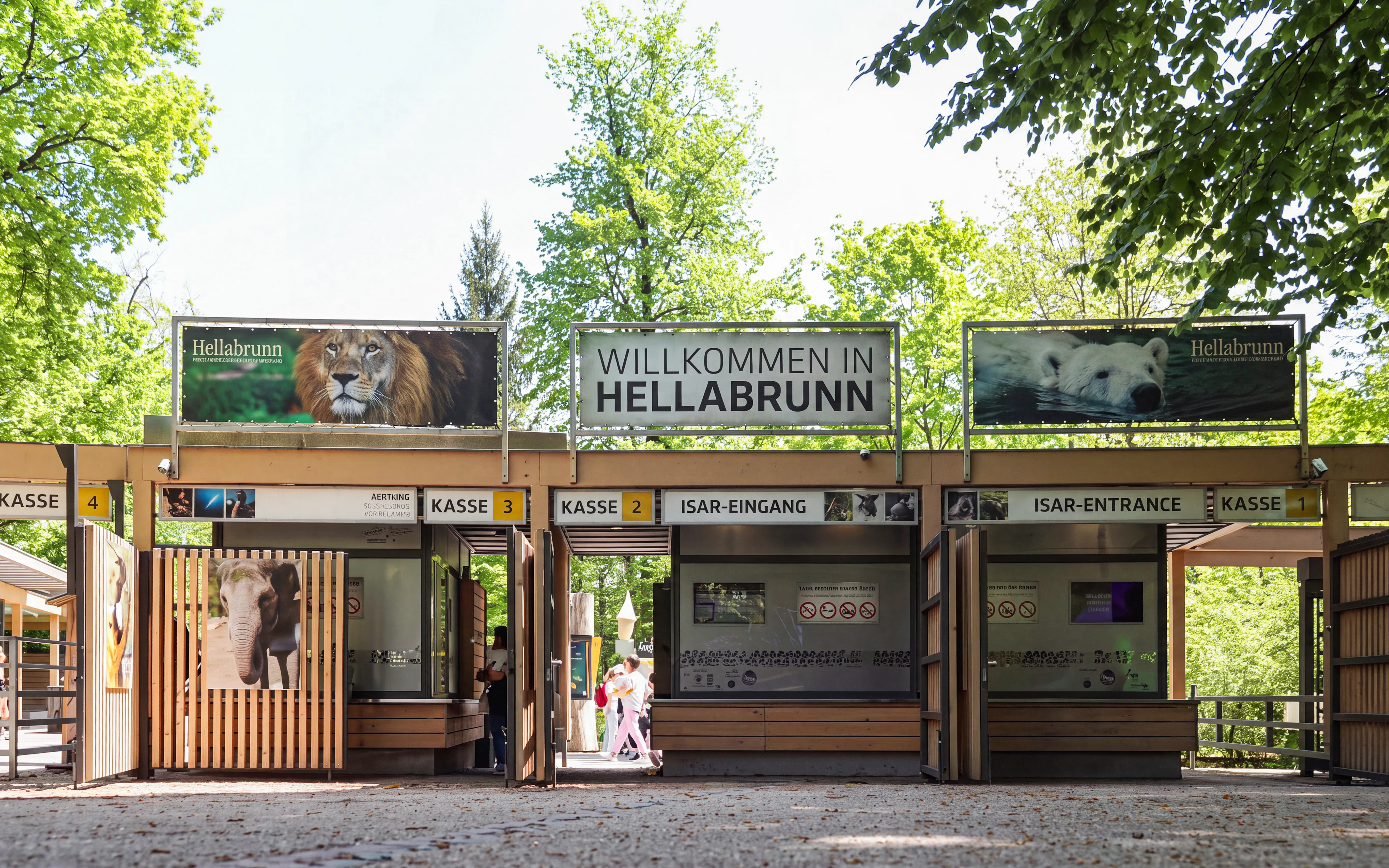 Hellabrunn Zoo entrance with ticket booths and animal images, Munich.