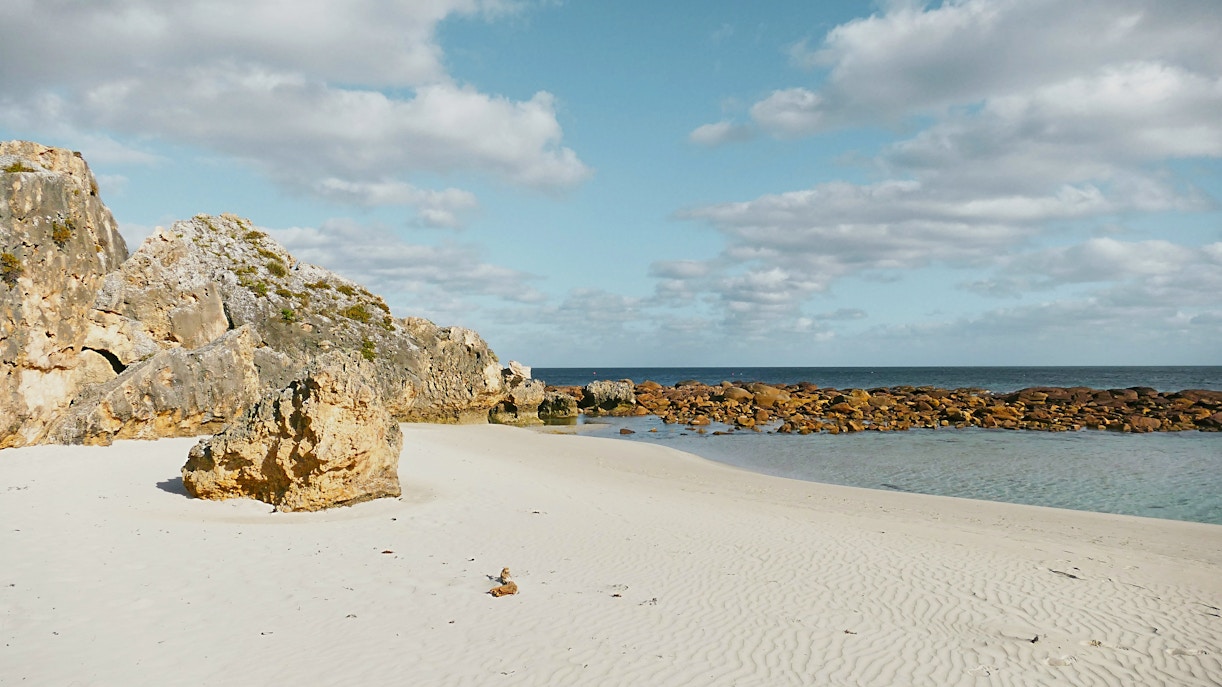 Coastal rocks and sandy beach at Stokes Bay, Kangaroo Island.