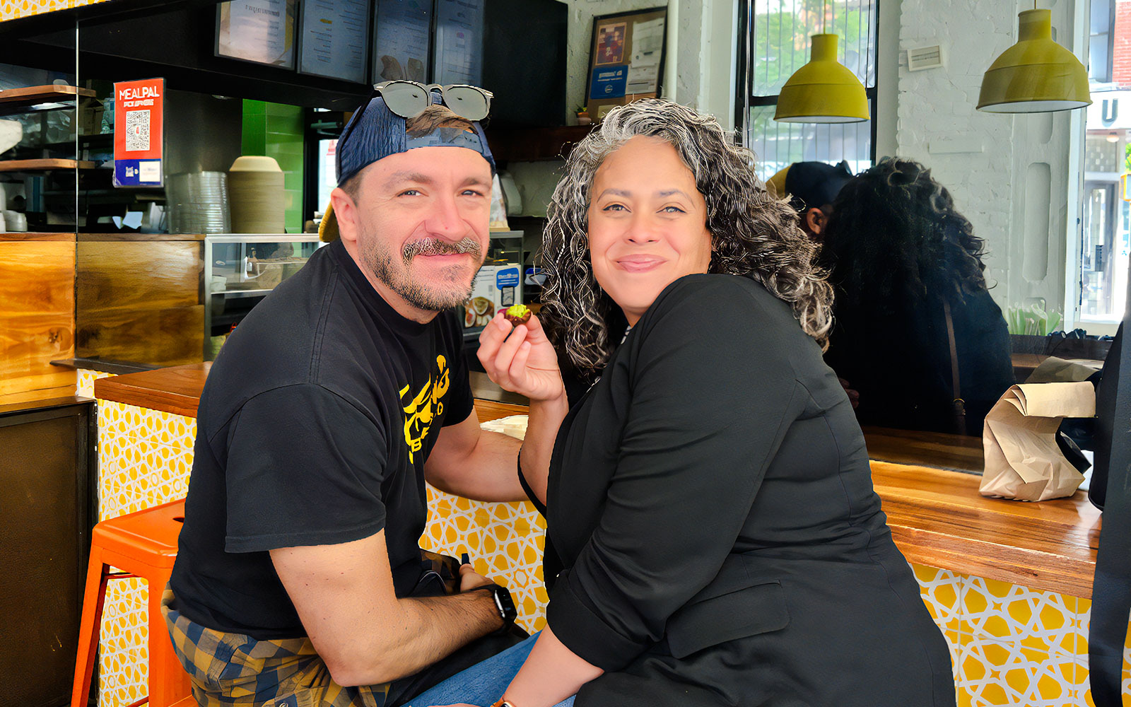 Tourists enjoying a tasting at Ahoy New York Food Tours.
