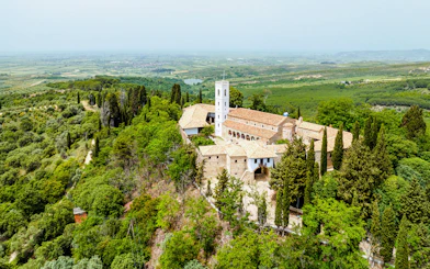 Aerial view of Monastery of Ardenica surrounded by lush greenery in Albania.